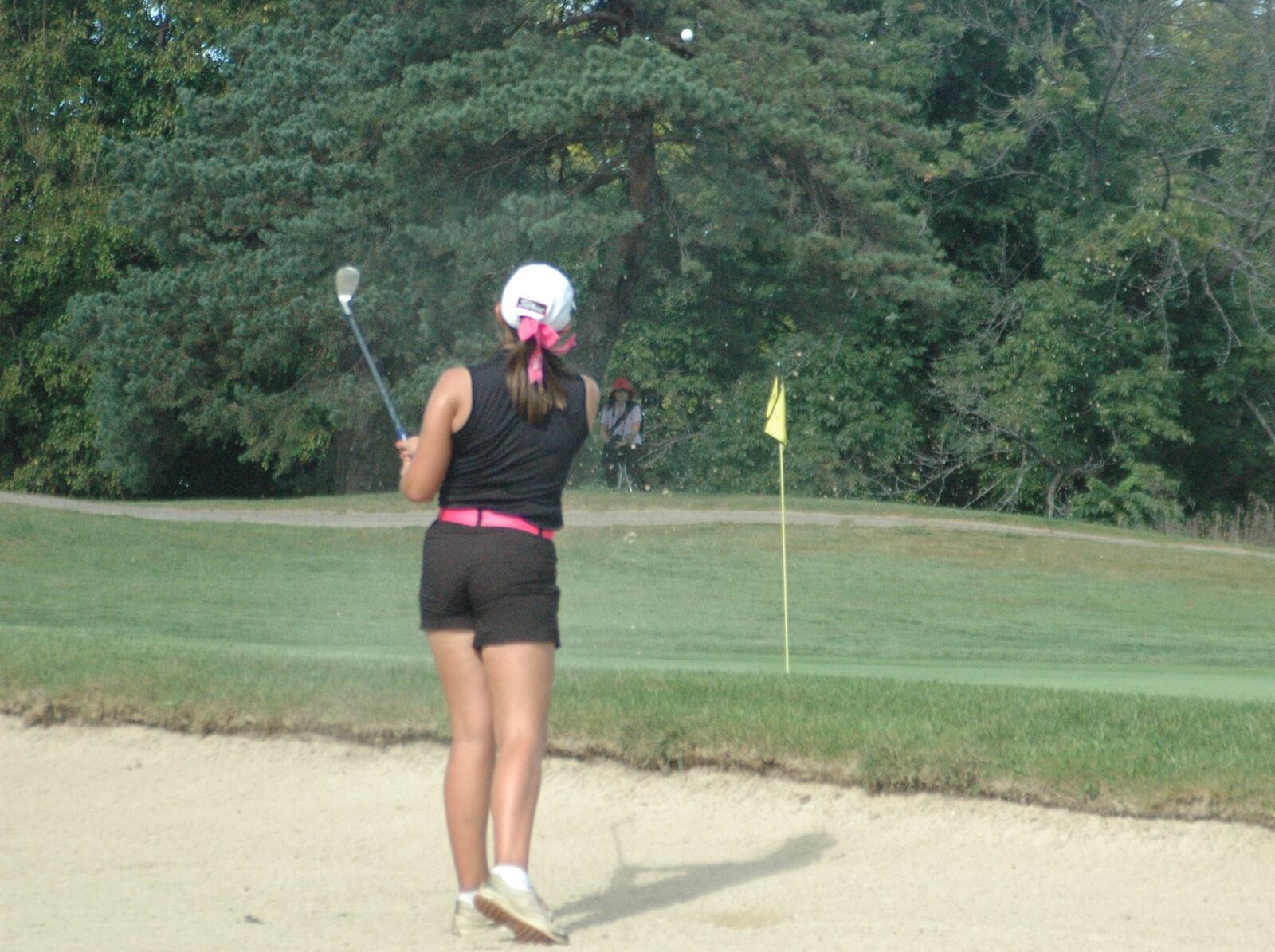 Lakota East’s Ellie Yeazell hits out of a sand trap and onto the green Tuesday during the Division I district girls golf tournament at Glenview Golf Course. RICK CASSANO/STAFF