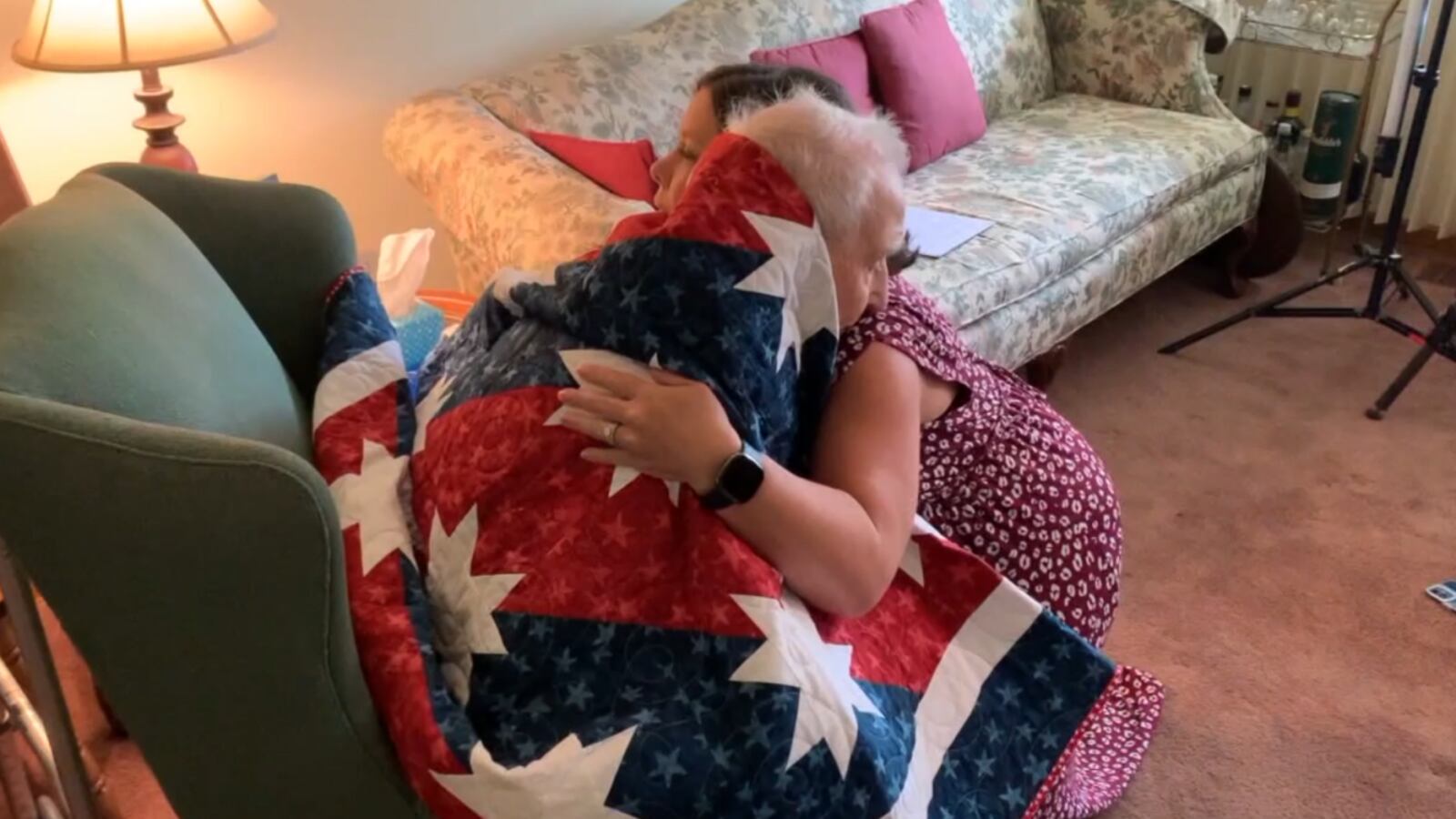 Michelle Nelson, an Air Force veteran and avid quilter for the nonprofit Quilts of Valor, hugs Marvin Sizemore, who is seen with a quilt of valor to honor his service to our country. WCPO/CONTRIBUTED