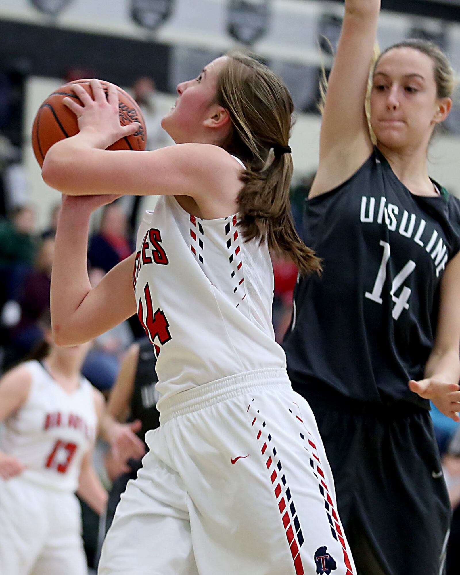 Talawanda guard Addie Brown gets past Ursuline guard Claudia Johnson and eyes the basket Wednesday night during Division I sectional play at Lakota East. CONTRIBUTED PHOTO BY E.L. HUBBARD