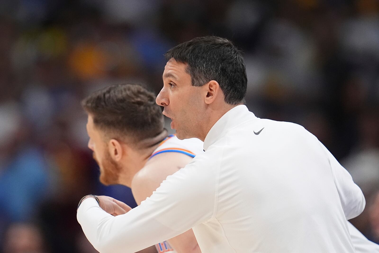 Oklahoma City Thunder head coach Mark Daigneault, right, directs his team as center Isaiah Hartenstein, left, looks down the court in the first half of Game 4 in the Western Conference semifinals of the NBA basketball playoffs against the Denver Nuggets, Sunday, May 11, 2025, in Denver. (AP Photo/David Zalubowski)