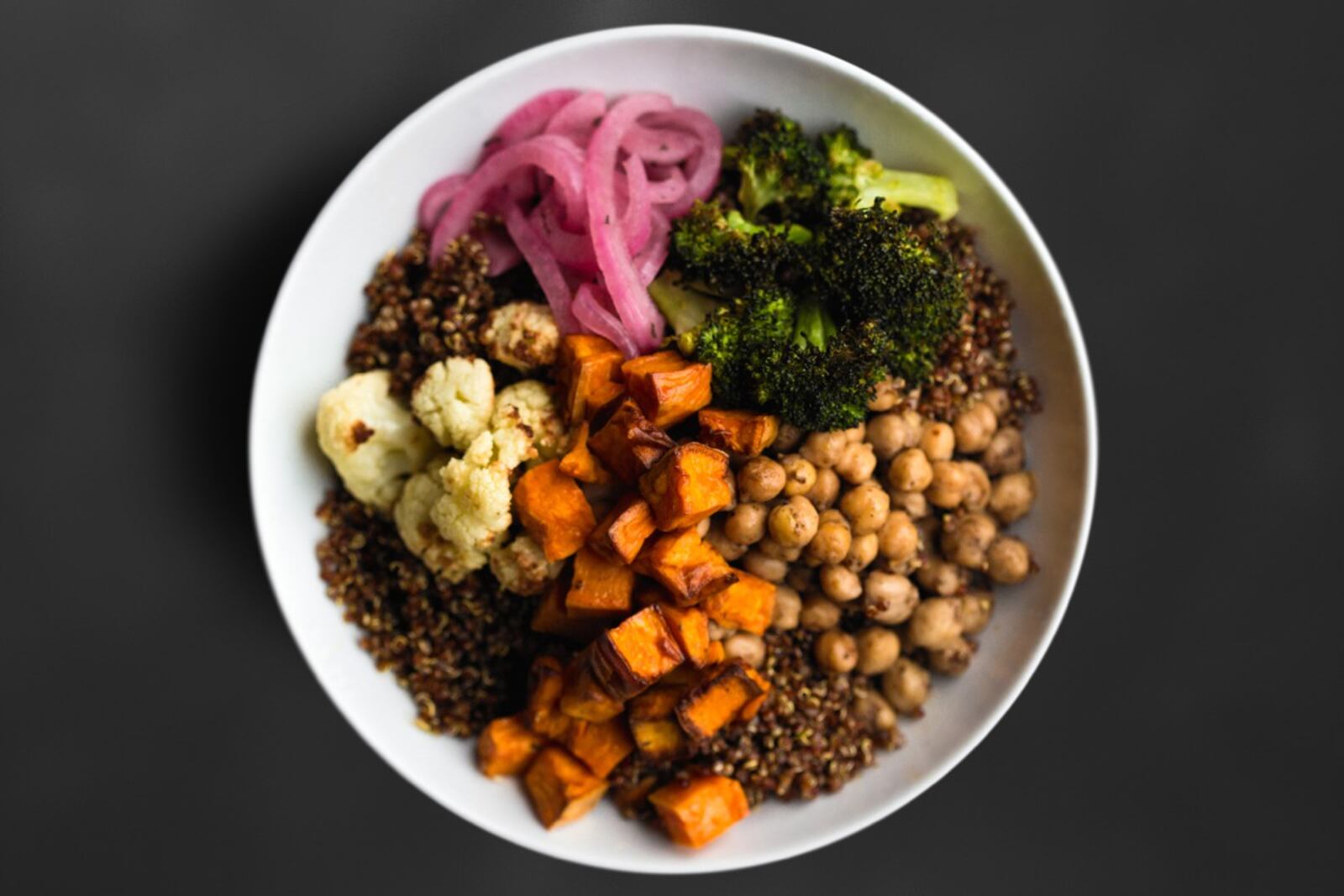 Piada's seasonal Mediterranean Power Bowl includes roasted vegetables like broccoli, cauliflower and sweet potatoes, glazed chickpeas and pickled red onions on a bed of red quinoa with harissa & Greek yogurt drizzle. CONTRIBUTED