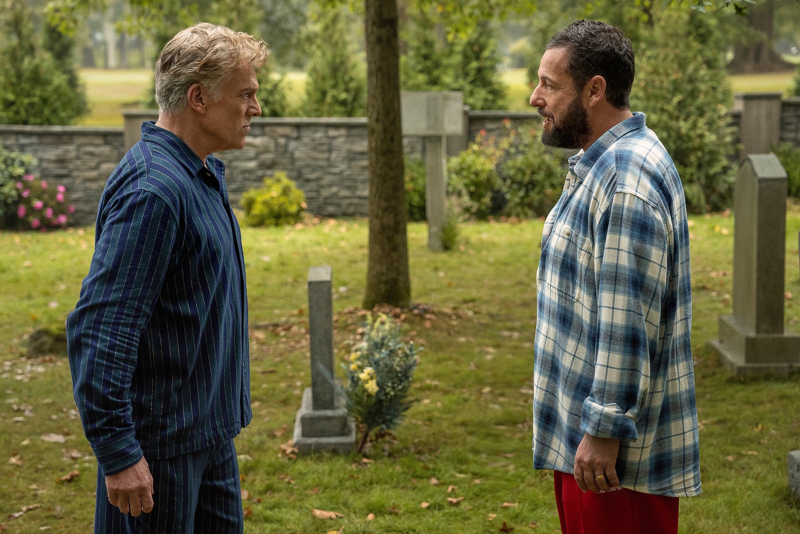 This image released by Netflix shows Christopher McDonald, left, and Adam Sandler in a scene from "Happy Gilmore 2." (Scott Yamano/Netflix via AP)