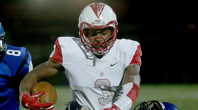 Carlisle’s D.J. Chambers is unable to escape from Brookville’s Michael Lander during their Division V football playoff game at Brookville on Nov. 6, 2015. The host Blue Devils won 41-0. CONTRIBUTED PHOTO BY E.L. HUBBARD