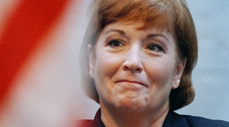 Nancy P. Hollister holds her hand on her heart during a ceremony at the Statehouse in Columbus on Dec. 31, 1998, in which she was sworn in as governor. Hollister is the only woman to ever hold the post in Ohio. She served for 11 days until Bob Taft was sworn in as governor on Jan. 11, 1999. (AP Photo/Chris Kasson)