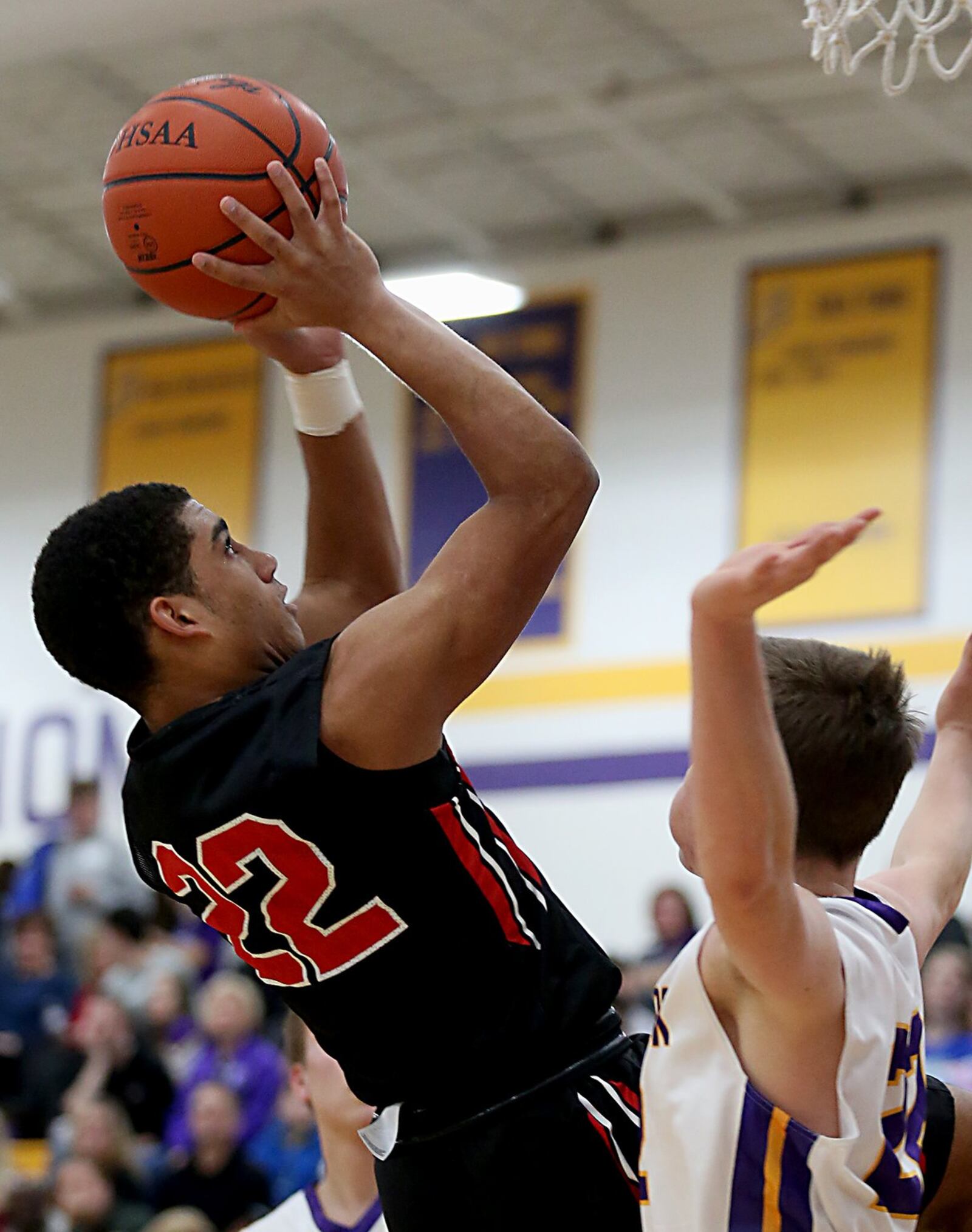 Franklin guard Ryan Montgomery gets the basket and the foul on Bellbrook forward Sean Ulrich during Friday night’s game at Bellbrook. CONTRIBUTED PHOTO BY E.L. HUBBARD