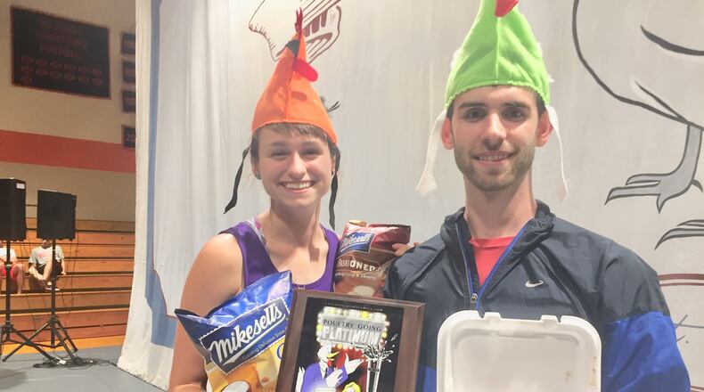Ryan Stoneberger and his fiancee pose with their prizes after purchasing the One Millionth chicken dinner at Poultry Days in Versailles