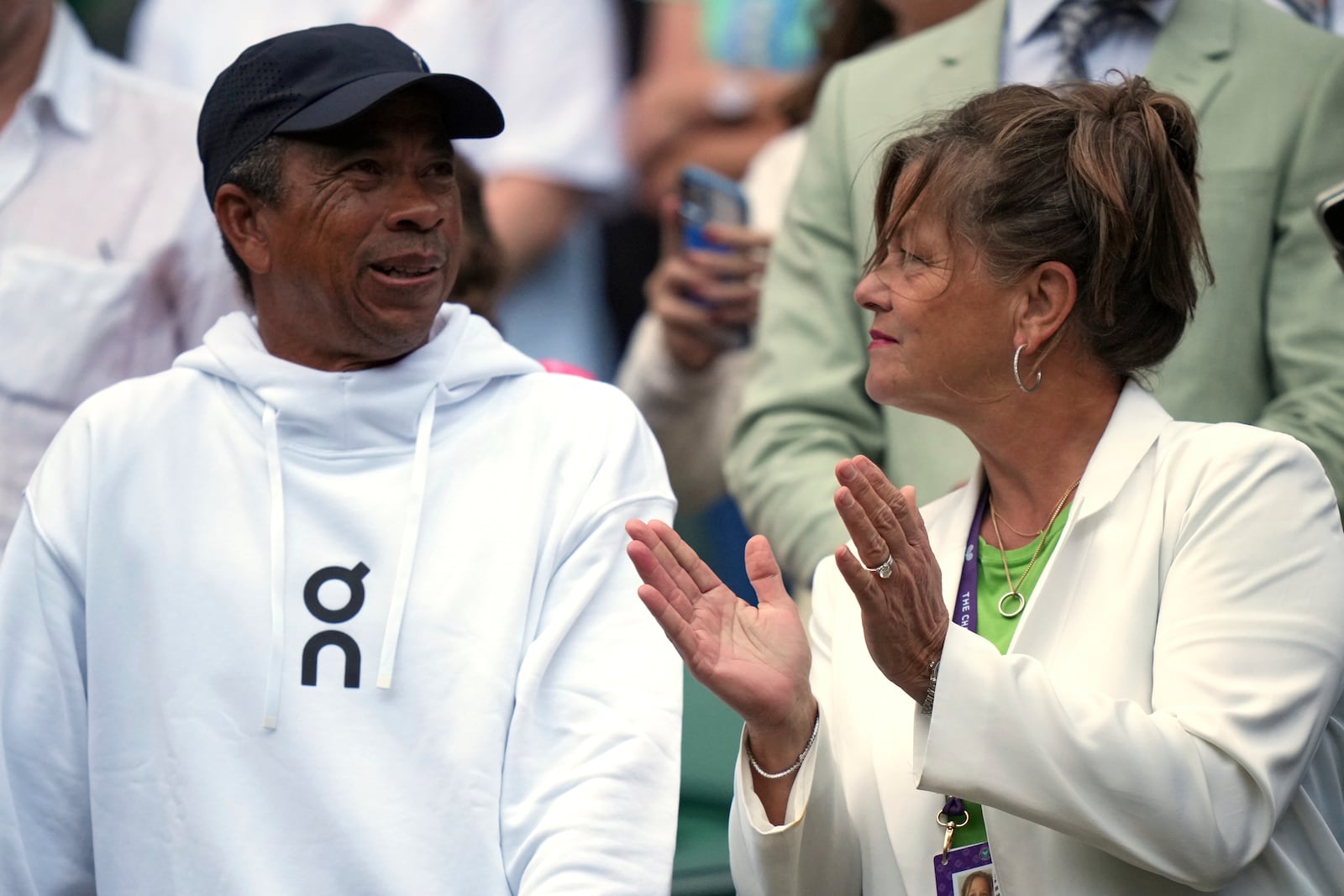 Shelton's parents, Bryan Shelton and Lisa Witsken Shelton, applaud after Ben Shelton of the U.S. won his men's singles third round match against Marton Fucsovics of Hungary at the Wimbledon Tennis Championships in London, Saturday, July 5, 2025.(AP Photo/Alastair Grant)