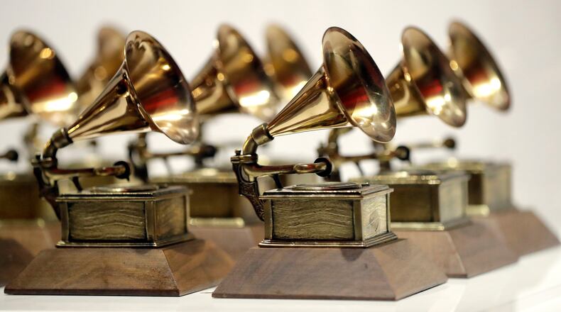 FILE - Grammy Awards are displayed at the Grammy Museum Experience at Prudential Center in Newark, N.J. on Oct. 10, 2017. (AP Photo/Julio Cortez, File)