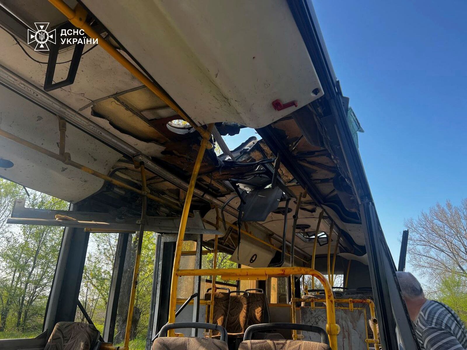 In this photo provided by the Ukrainian Emergency Service, a damaged bus that was hit by the Russian drone in Marhanets, Dnipropetrovsk region, Wednesday, April 23, 2025. (Ukrainian Emergency Service via AP)