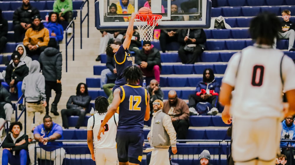 Garfield Heights junior Marcus Johnson dunks the ball during their game against Wayne at Flyin' to the Hoop showcase earlier this season. Michael Cooper/STAFF PHOTO