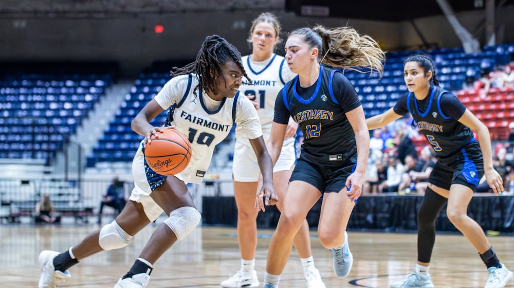 Fairmont High School sophomore Janiyah Hargrave drives past Olentangy senior Whitney Stafford during their regional final game on Friday, March 6, 2026 at the Ohio Expo Center's Taft Coliseum in Columbus. The Firebirds won 66-45 and advanced to a Division I state semifinal for the first time since 2013. MICHAEL COOPER / STAFF