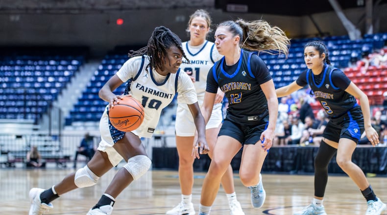 Fairmont High School sophomore Janiyah Hargrave drives past Olentangy senior Whitney Stafford during their regional final game on Friday, March 6, 2026 at the Ohio Expo Center's Taft Coliseum in Columbus. The Firebirds won 66-45 and advanced to a Division I state semifinal for the first time since 2013. MICHAEL COOPER / STAFF