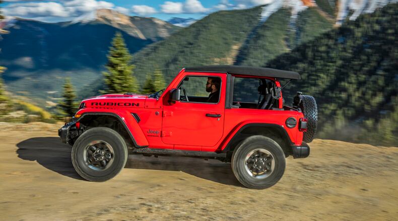 This photo from Jeep shows the 2021 Jeep Wrangler in its two-door version, a rough and rugged SUV that prioritizes off-road ability above all else. (Courtesy of FCA US via AP)