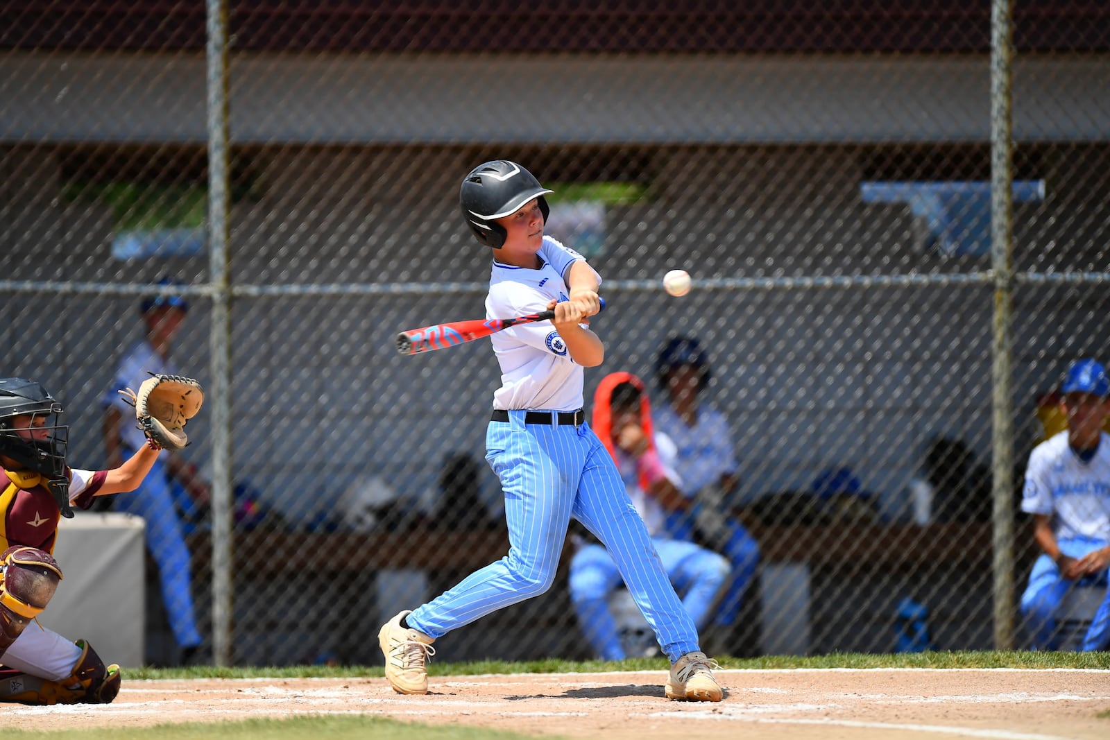 West Side's Gavyn Spears connects on a three-run homer during his Ohio Little League state championship game against New Albany on Thursday at the Field of Dreams in Boardman. West Side won 17-5. KYLE HENDRIX / CONTRIBUTED