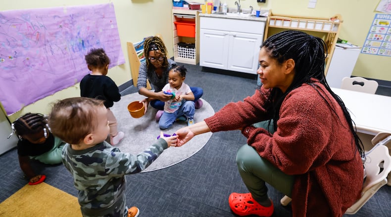 Monica Mills, left, and owner Markida Jackson tend to toddlers at Loving Babies N' Tots childcare Thursday, March 19, 2026. Ohio’s recent changes to publicly funded child care reimbursements are putting added pressure on providers already operating on slim margins, including Loving Babies N' Tots owner Markida Jackson of Hamilton. Jackson opened the business four years ago at 3320 Tylersville Road in Fairfield Twp. NICK GRAHAM/STAFF