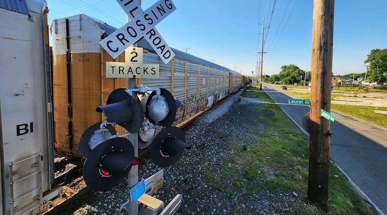A train blocks a Lindenwald intersection in Hamilton on Monday, July 11, 2022. NICK GRAHAM/STAFF