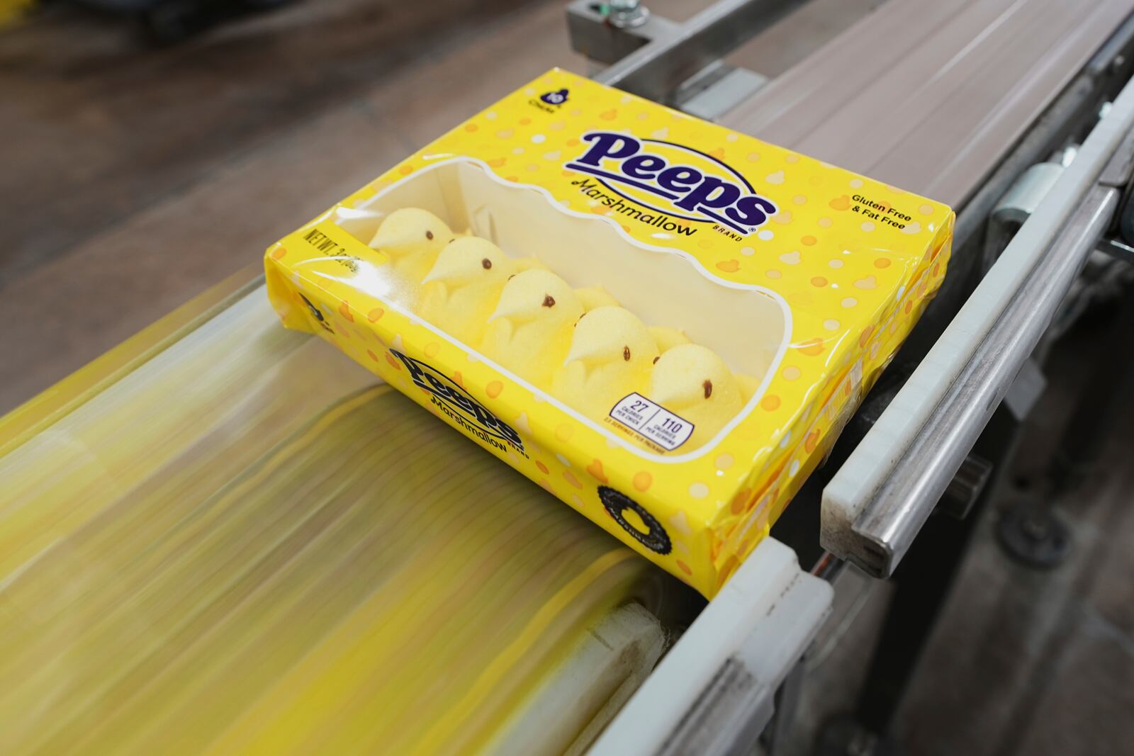 A box of Peeps marshmallow treats moves through the manufacturing process at the Just Born factory in Bethlehem, Pa., Thursday, April 10, 2025. (AP Photo/Matt Rourke)