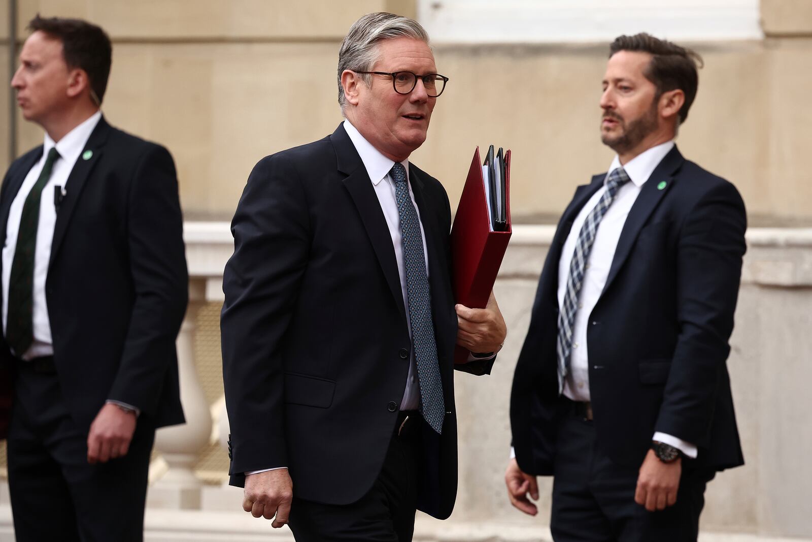 Britain's Prime Minister Keir Starmer, center, arrives to attend the UK-EU Summit at Lancaster House, in London, Monday, May 19, 2025. (Henry Nicholls/Pool Photo via AP)