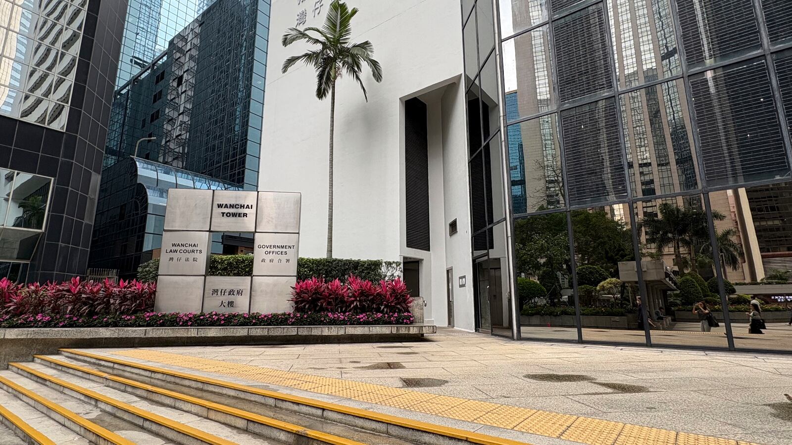 This photo shows the building housing the Hong Kong District Court where a Hong Kong judge sentences social worker Jackie Chen to three years and nine months in prison on a charge of riot for her role in the 2019 anti-government movement on Wednesday, April 9, 2025 in Wan Chai, Hong Kong. (AP Photo/Kanis Leung)