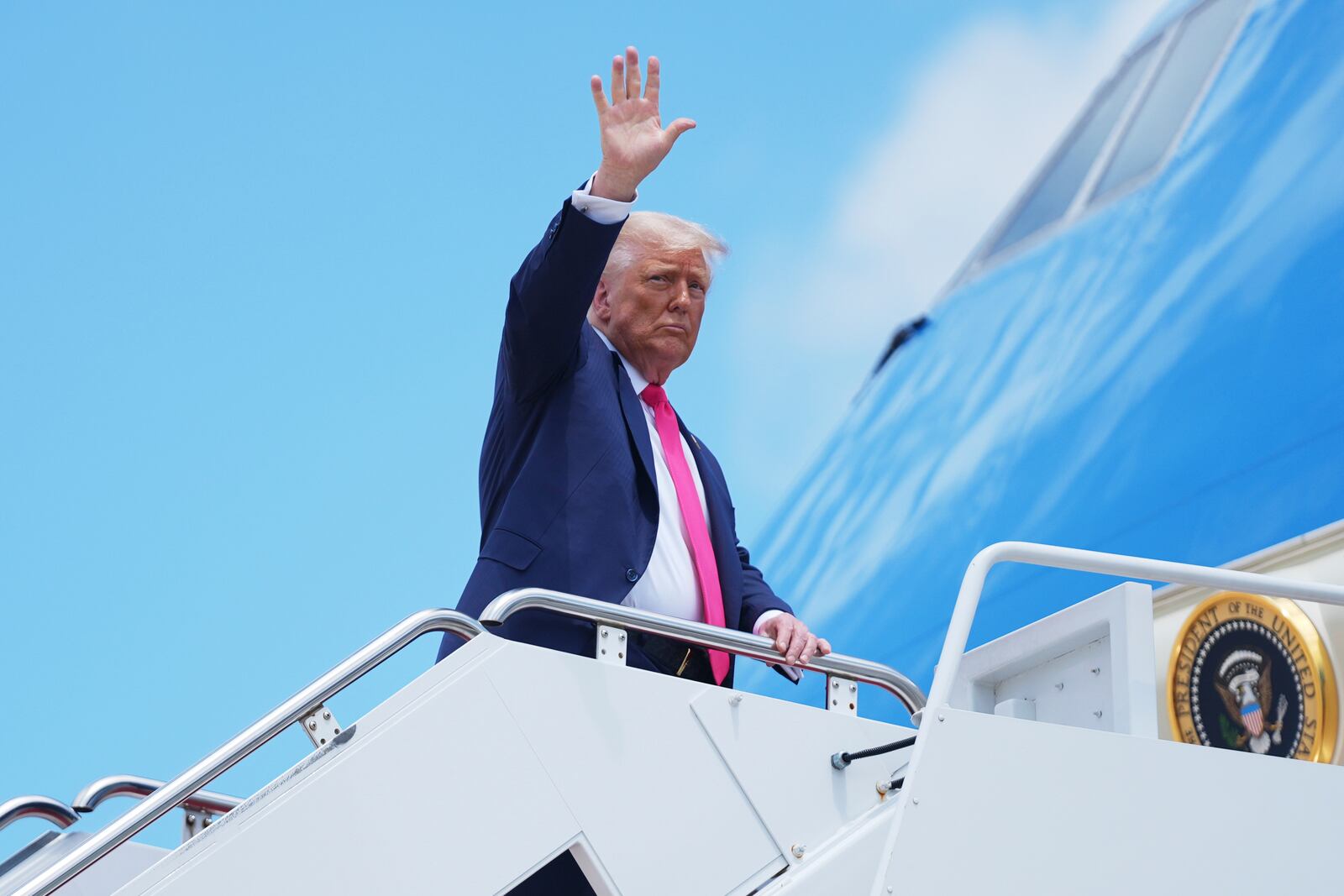 President Donald Trump gestures as he boards Air Force One, Tuesday, July 15, 2025, in Joint Base Andrews, Md. (AP Photo/Evan Vucci)