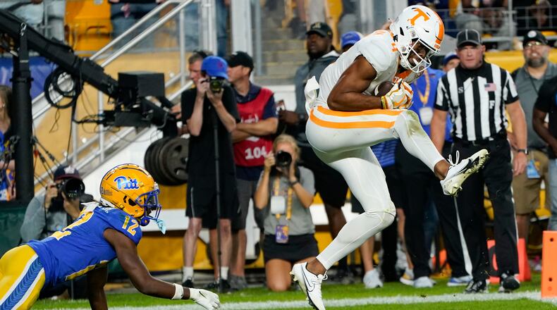 Tennessee wide receiver Cedric Tillman makes a catch for a touchdown in front of Pittsburgh defensive back M.J. Devonshire during overtime of an NCAA college football game, Saturday, Sept. 10, 2022, in Pittsburgh. Tennessee won 34-27. (AP Photo/Keith Srakocic)