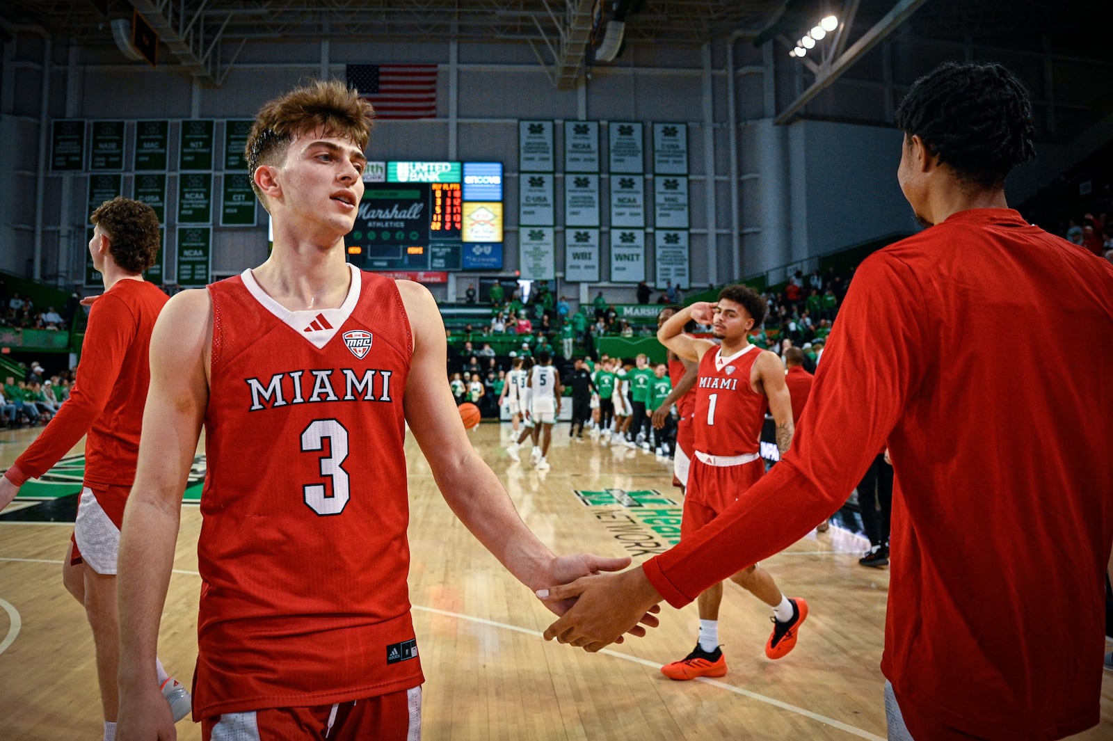 Miami (Ohio) Guard Luke Skaljac (3) celebrates with a teammate after an NCAA college Basketball game against Marshall, Saturday, Feb. 7, 2026, in Huntington, W.Va. (AP Photo/Tyler Evert)