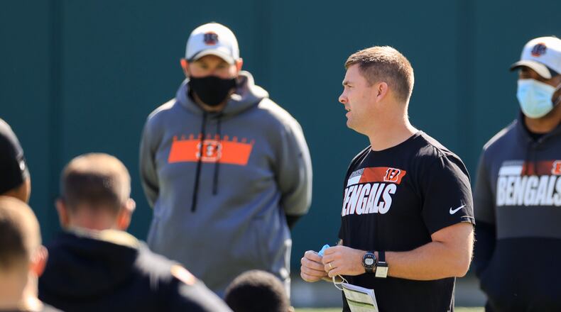 Cincinnati Bengals head coach Zac Taylor speaks to his team during an NFL football rookie minicamp in Cincinnati, Friday, May 14, 2021. (AP Photo/Aaron Doster)