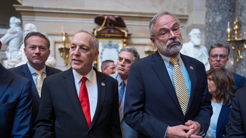 After a deal was approved to fund the Department of Homeland Security, except for immigration operations, members of the conservative House Freedom Caucus, including Rep. Andy Biggs, R-Ariz., left, and Rep. Andy Harris, R-Md., right, tell reporters that they won't vote in the House to pass it as is, at the Capitol in Washington, Friday, March 27, 2026. (AP Photo/J. Scott Applewhite)