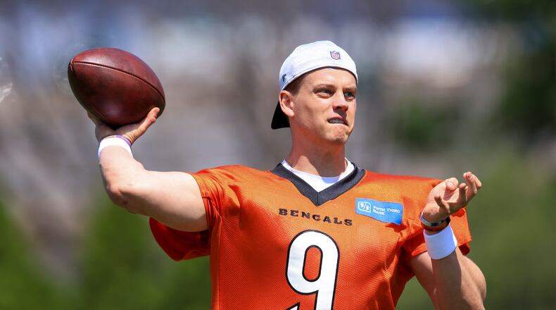 Cincinnati Bengals' Joe Burrow throws a pass as he participates in a drill during an NFL football practice in Cincinnati, Tuesday, May 24, 2022. (AP Photo/Aaron Doster)