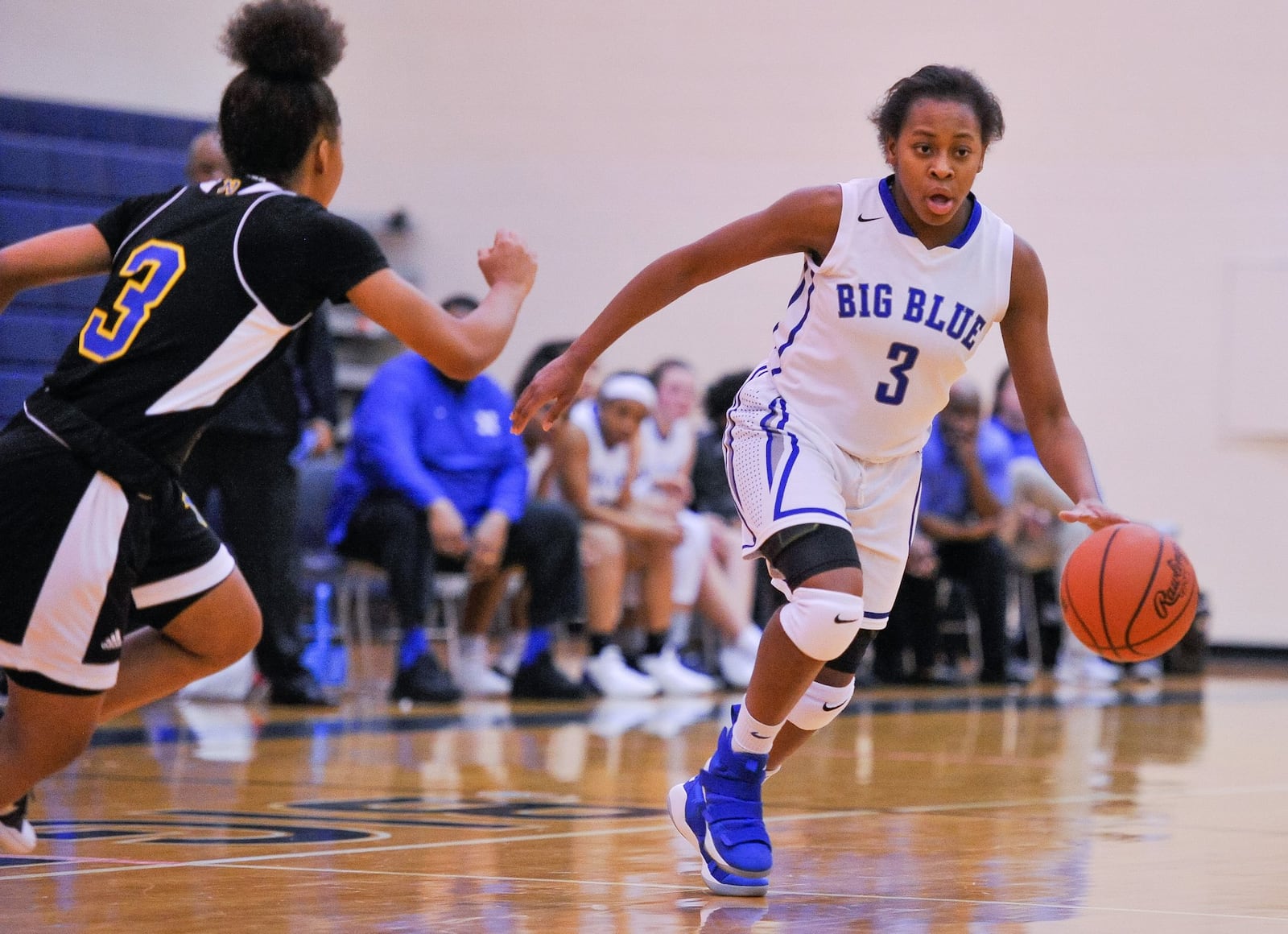 Hamilton’s Anna Cardwell dribbles the ball against Northwest’s Sante Williams during Thursday night’s game at the Hamilton Freshman School. The visiting Knights won 62-51. NICK GRAHAM/STAFF