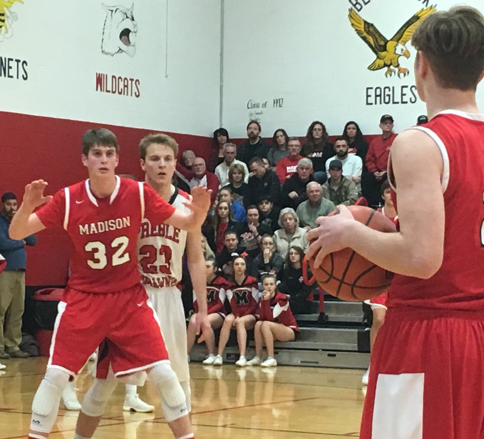 Madison’s Grant Whisman (32) awaits a pass from teammate Tristan Sipple as Preble Shawnee’s Joey Bates (23) defends Feb. 9 at Shawnee. RICK CASSANO/STAFF