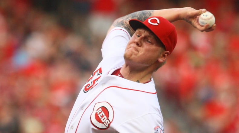 The Reds' Mat Latos pitches against the Athletics on Tuesday, Aug. 6, 2013, at Great American Ball Park in Cincinnati. David Jablonski/Staff