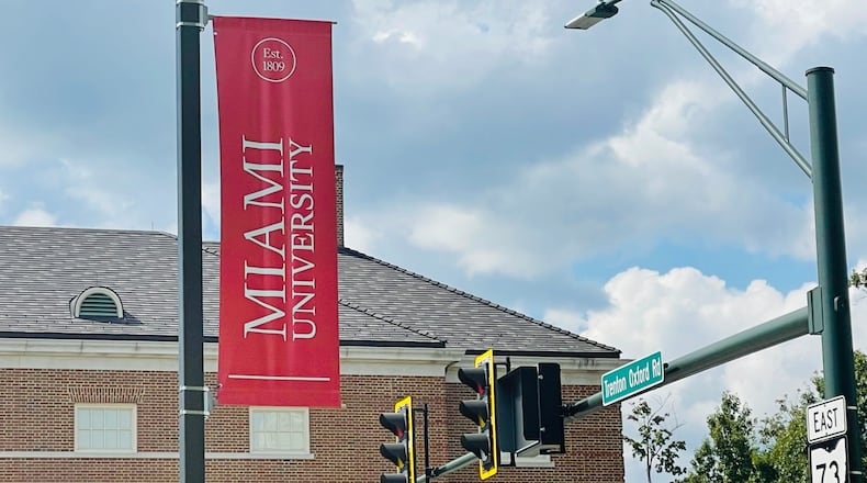 A Miami University banner hangs on a post, visible to those entering Oxford from Ohio 73. STAFF FILE PHOTO