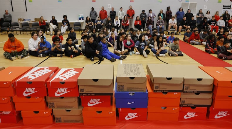 Fifth-grade students at Fairfield Central Elementary were given new shoes during a surprise assembly Friday, March 15, 2024 thanks to some fundraising and help from an Ohio-based, non-profit organization called Just a Pair of Shoes. The organization is focused on one mission: to put quality name-brand shoes on young students' feet, boost confidence, and create a sense of belonging. Each fifth grader will be outfitted with a pair of Nike shoes. They got the sizes by having the students measure their feet under the guise of a math lesson. NICK GRAHAM/STAFF