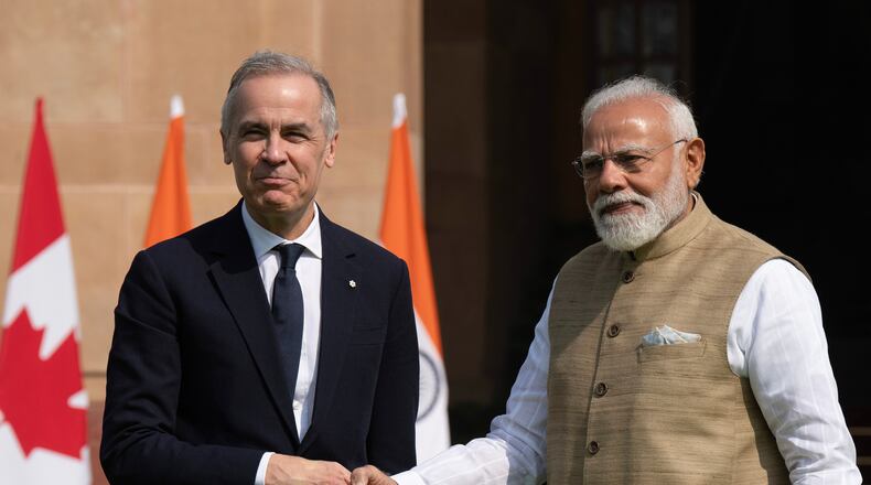 Canada's Prime Minister Mark Carney, left, meets Indian Prime Minister Narendra Modi at Hyderabad House in New Delhi, Monday, March 2, 2026. (Adrian Wyld/The Canadian Press via AP)