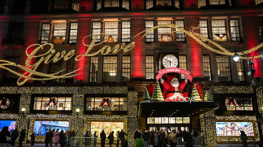 Black Friday Shoppers wait in line to enter Macy's flagship store on Friday, Nov. 28, 2025 in New York. (AP Photo/Angelina Katsanis)