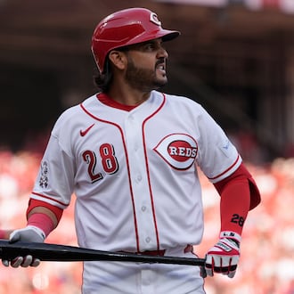 Cincinnati Reds third baseman Eugenio Suárez reacts after striking out during the sixth inning of an opening-day baseball game against the Boston Red Sox in Cincinnati, Thursday, March 26, 2026. (AP Photo/Carolyn Kaster)