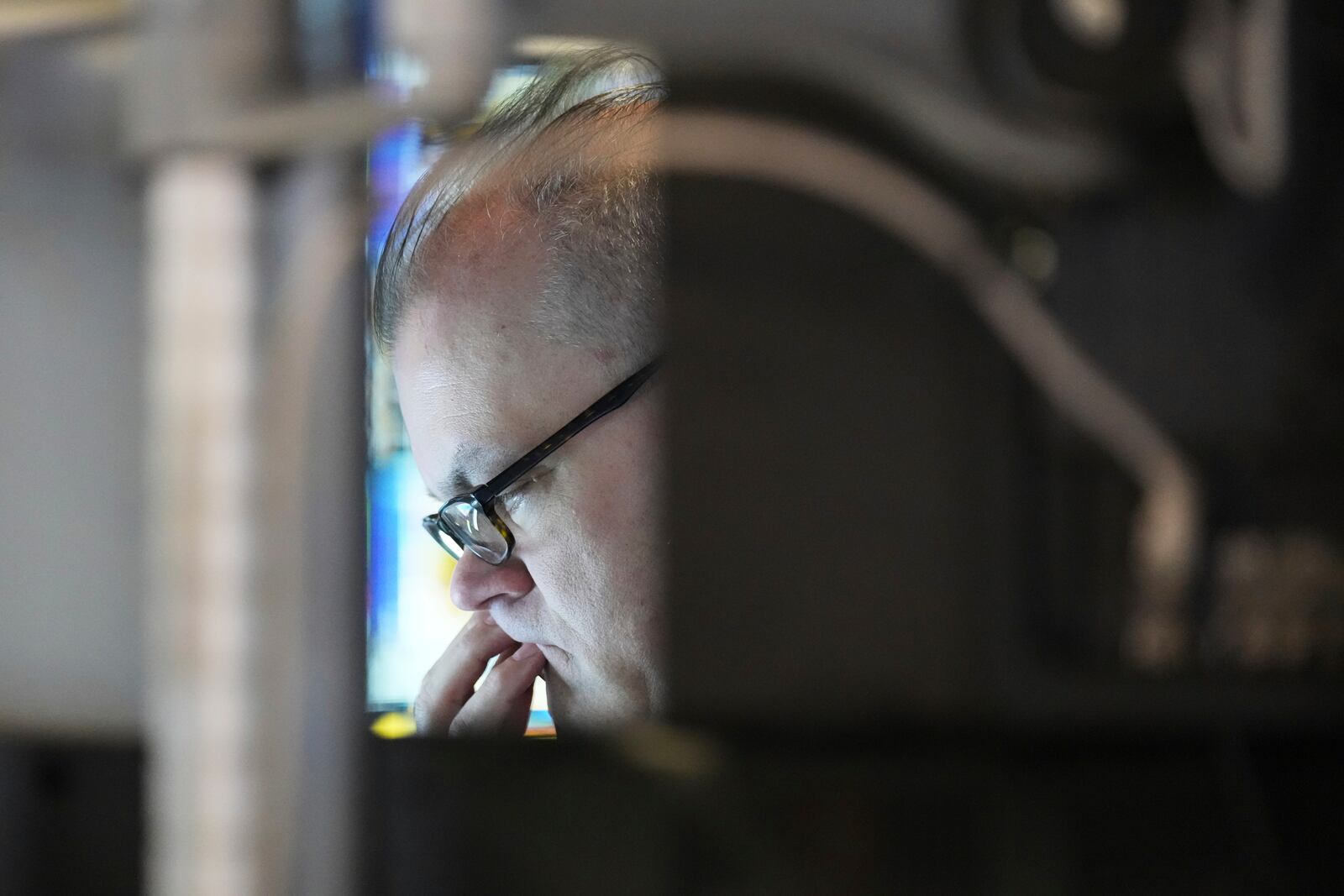 A trader works on the floor at the New York Stock Exchange in New York, Thursday, April 3, 2025. (AP Photo/Seth Wenig)