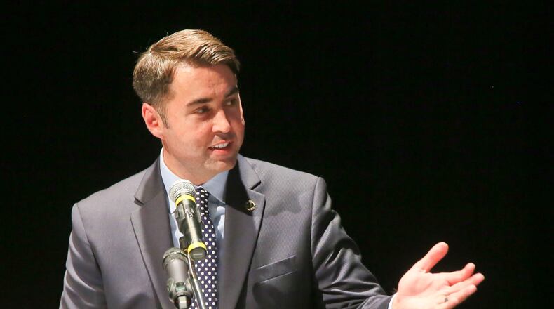 Hamilton City Manager Joshua Smith speaks during a groundbreaking ceremony for the South Hamilton Crossing project in 2016. GREG LYNCH/FILE