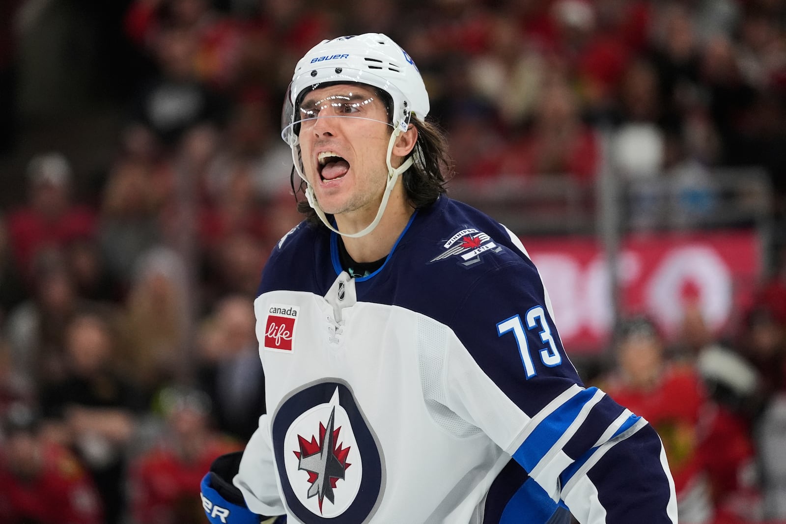 Winnipeg Jets left wing Brandon Tanev argues with an official during the first period of an NHL hockey game against the Chicago Blackhawks, Saturday, April 12, 2025, in Chicago. (AP Photo/Erin Hooley)