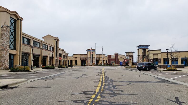 The parking lot at Bridgewater Falls in Fairfield Township is mostly empty due to the Stay-At-Home order in place. The coronavirus pandemic is really just in its infancy here but Butler County governments are starting to take steps in case sales, income tax and other revenues tumble under shelter in place orders. The largest revenue source for county government is sales tax. While people are still allowed to shop, and are in some cases are spending a lot hoarding things like toilet paper, the projected $44 million in Butler County sales tax revenues is sure to plummet the longer the pandemic lingers. NICK GRAHAM / STAFF