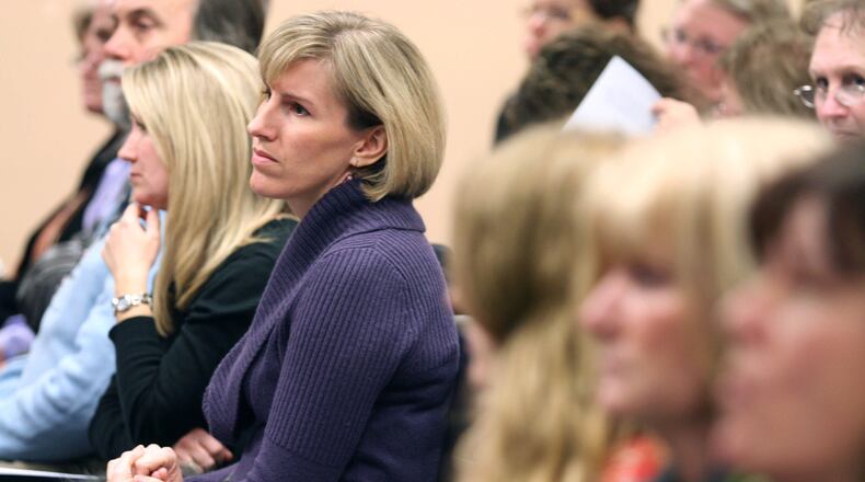 In this 2010 file photo, a woman listens during the Lakota Local Schools Board of Education meeting. This fall’s Butler County school board races are already attracting candidates in some districts but not many in others. STAFF FILE PHOTO
