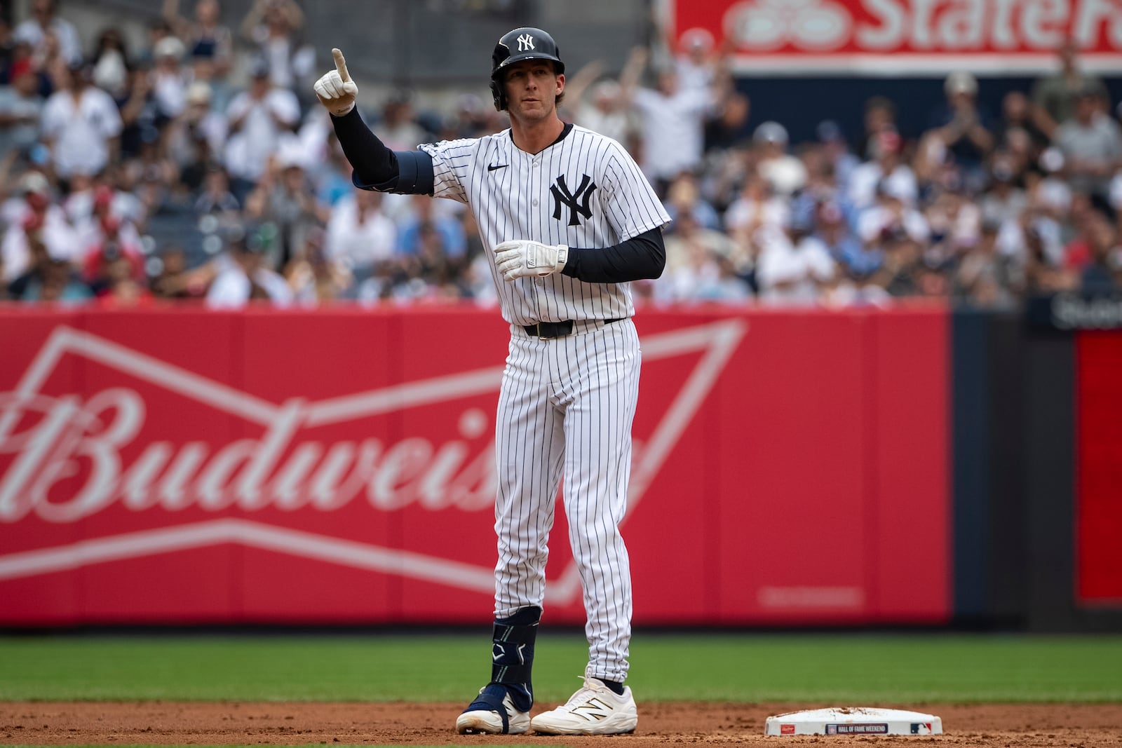 New York Yankees' Ryan McMahon celebrates after his two-run double during the second inning of a baseball game against the Philadelphia Phillies, Sunday, July 27, 2025, in New York. (AP Photo/Angelina Katsanis)