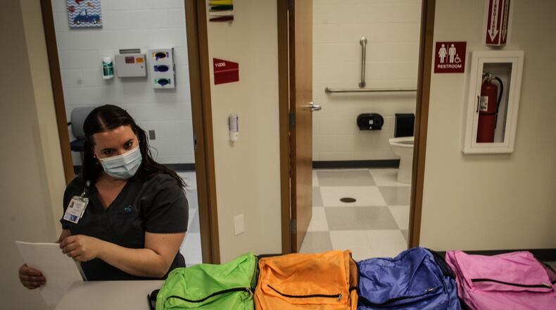 Five River Health Center in Roosevelt Elementary School readies the office for area children who needs to catch up on vaccines. The backpacks in the picture have treats in them for the kids. JIM NOEILKER/STAFF