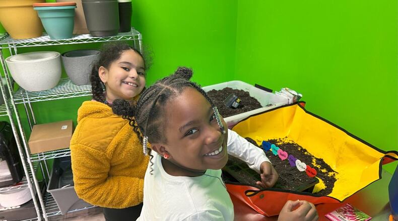 A grant from a national charity group through a local chapter has students at an elementary here growing their minds through growing some food. Students at Middletown’s Rosa Parks Elementary, pictured, are planting seedlings inside a specially designed classroom space to learn about gardening and the importance of healthy food. CONTRIBUTED