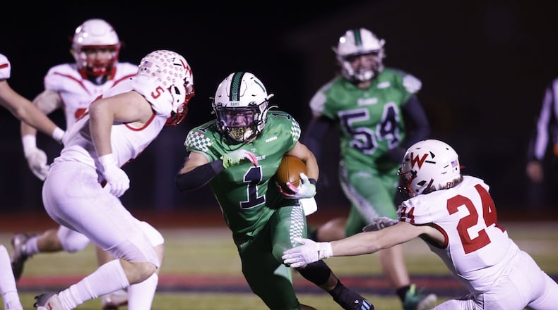 Badin's Carter Russo carries the ball during their 16-9 win over Wapakoneta in the Division III Regional Semifinal football game Friday, Nov. 11, 2022 at Trotwood-Madison High School. NICK GRAHAM/STAFF