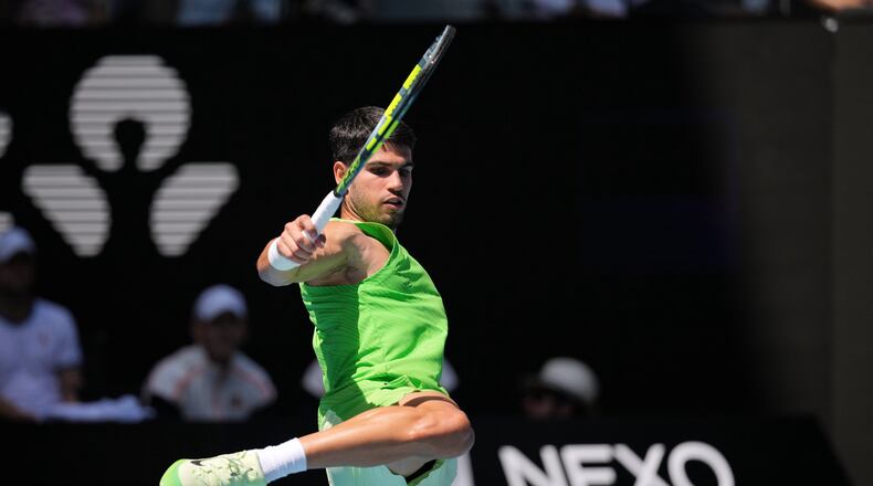 Carlos Alcaraz of Spain kicks the ball during his fourth round match against Tommy Paul of the U.S. at the Australian Open tennis championship in Melbourne, Australia, Sunday, Jan. 25, 2026. (AP Photo/Dita Alangkara)