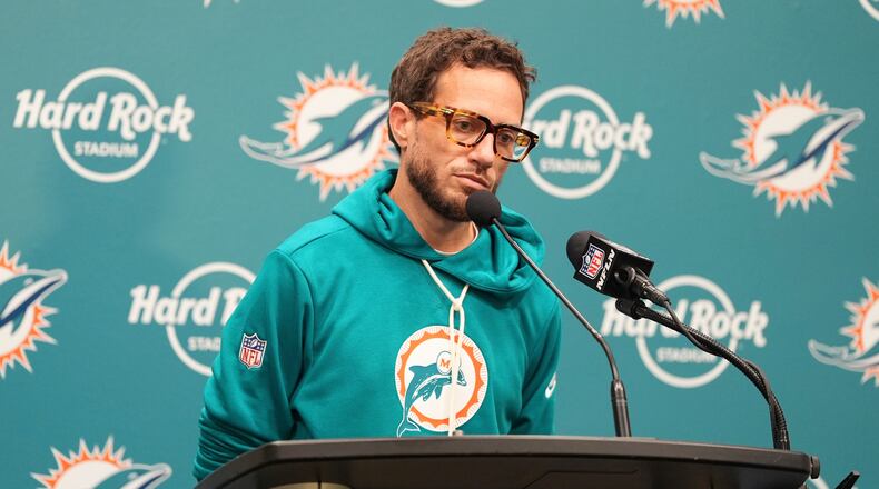 Miami Dolphins head coach Mike McDaniel ponders a question at news conference following a loss to the Cincinnati Bengals in an NFL football game, Sunday, Dec. 21, 2025, in Miami Gardens, Fla. (AP Photo/Rebecca Blackwell)
