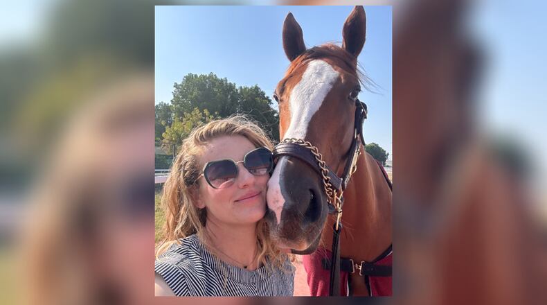 Oxford native and assistant trainer Chelsie Raabe poses with the 2023 Golden Shaheen-winning horse, Sibelius. CONTRIBUTED