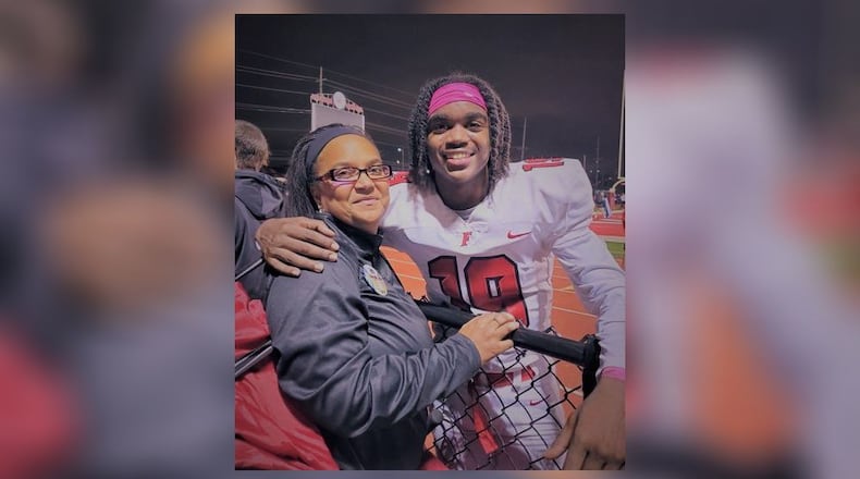 Fairfield High School football star Jaydan Mayes, shown here celebrating a victory this fall with his mother Kelli Hutchings, was surprised and then thrilled to get a scholarship offer from the U.S. Military Academy at West Point. Mayes plans to play for the Army Black Knights and hopes to later pursue a career as a lawyer. (Provided Photo\Journal-News)